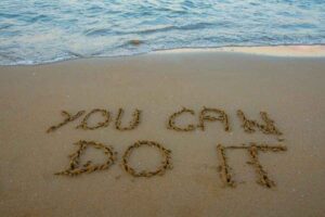 You Can Do It written into beach sand