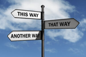 Crossroad signpost saying this way, that way, another way concept for lost, confusion or decisions